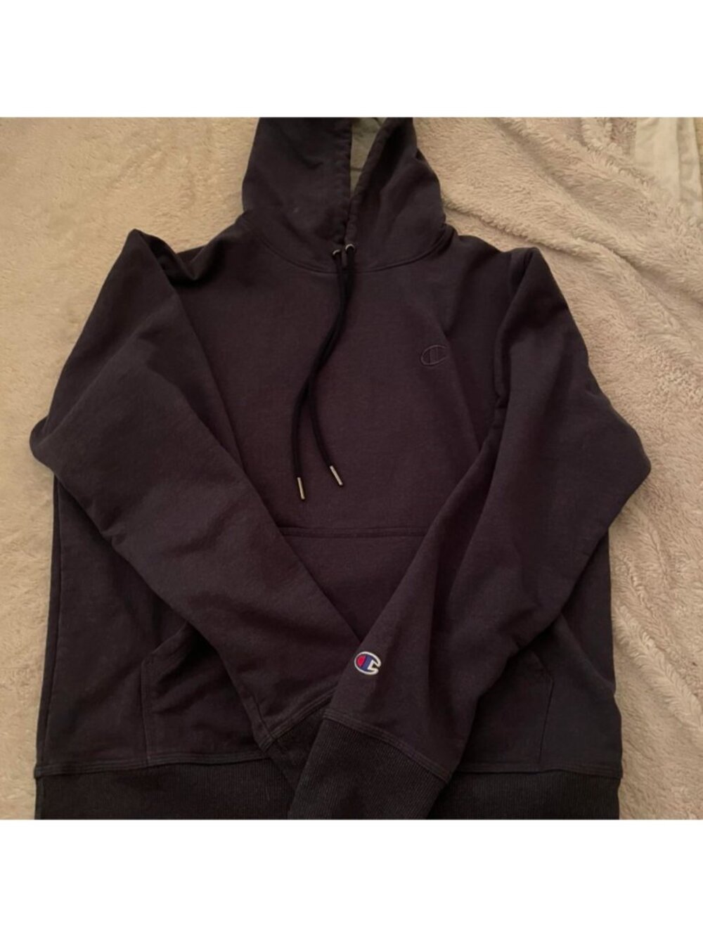 Navy blue champion hoodie. It didn’t fit me unfortunately but it’s super comfy!